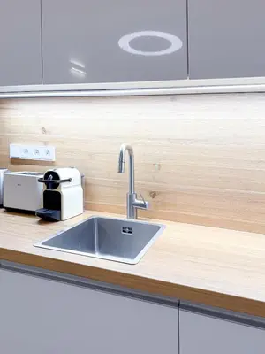 a kitchen counter with a sink and a toaster at Picasso Residence XXL 100m2 in Prague