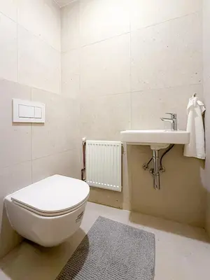 a bathroom with a toilet and a sink at Picasso Residence XXL 100m2 in Prague
