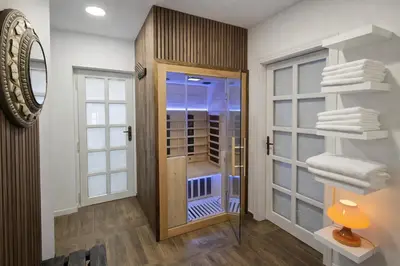 a bathroom with a walk in closet and a glass door at Jevany Four Bedroom Luxury Villa by the Lake with Infrasauna and Grill in Jevany