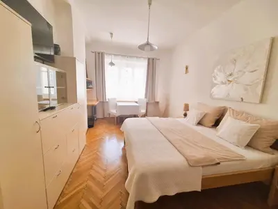 a bedroom with a large bed in a room at St. Hubert House in Prague
