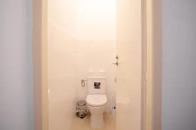 a bathroom with a white toilet in a room at St. Hubert House in Prague