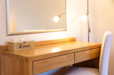 a dressing table with a box on it next to a mirror at St. Hubert House in Prague