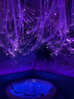 a bunch of lights hanging from a ceiling at SPA SPA Petrská in Prague