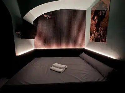 a bed with two towels on it in a room at SPA SPA Petrská hostel in Prague