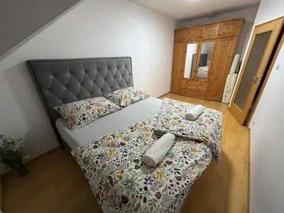 a living room with a couch and a tv at Prague For You 22 in Prague