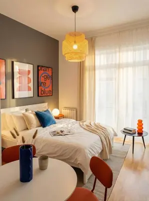 a bedroom with a bed and a table and chairs at Emora Terrace Apartment in Prague