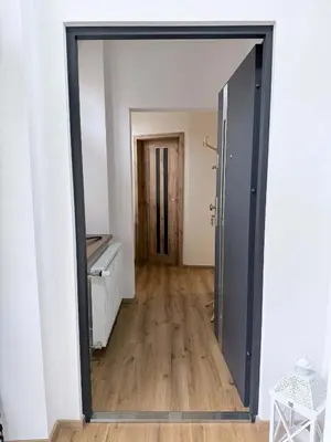 a large mirror in a room with a hallway at Parkány Litoměřice in Litoměřice