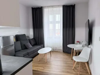 a living room with a couch and a table at Parkány Litoměřice in Litoměřice