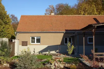 a house with a brown roof and a yard at Chalupa Kdovíkde in Budyně nad Ohří