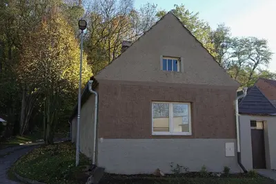 a small house with a window on the side of it at Chalupa Kdovíkde in Budyně nad Ohří