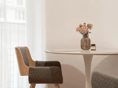 a bedroom with a green chair next to a bed at REAL Living by REFA - New Town 216 in Prague