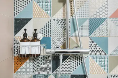 a bathroom with a rack with bottles on it at Central Studio Apartment with Parking - Near Main Train Station & Wenceslas Square in Prague