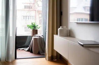 a room with a window with a potted plant at Prague Modern Apartment in Prague