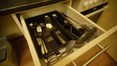 a drawer with utensils in a kitchen at Spacious 2 Bedroom Apartment in Prague 2 in Prague