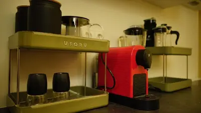 a red toaster sitting on top of a counter at Spacious 2 Bedroom Apartment in Prague 2 in Prague