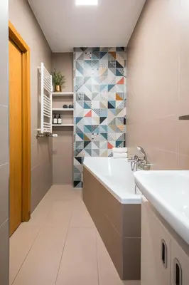 a bathroom with a tub and a mosaic tile wall at Central 2 Bedrooms Apartment with Living Room & Parking - Near Wenceslas Square & Main Train Station in Prague