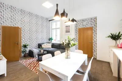 a living room with a white table and a couch at Central 2 Bedrooms Apartment with Living Room & Parking - Near Wenceslas Square & Main Train Station in Prague