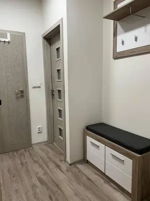 a room with a door and a bench in a room at Urban Chic Apartment Prague 1 in Prague