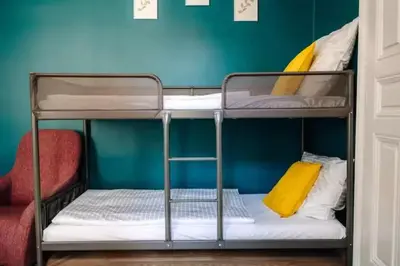 a couple of bunk beds in a room at Spacious 3BR Apartment with Billiards & Cinema in Prague