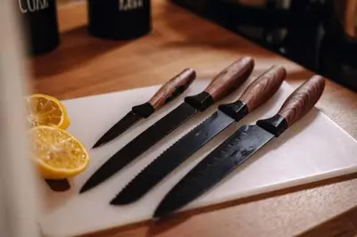 a group of knives on a cutting board with an orange slice at Spacious 3BR Apartment with Billiards & Cinema in Prague