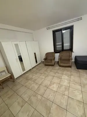 a living room with two chairs and a couch at Ubytování Mladá Boleslav in Mladá Boleslav
