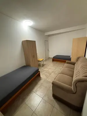 a room with two beds and a couch and a bed at Ubytování Mladá Boleslav in Mladá Boleslav