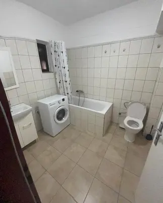a bathroom with a toilet and a bath tub and a sink at Ubytování Mladá Boleslav in Mladá Boleslav