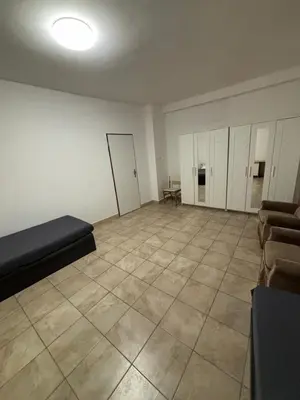 a large room with a couch and a tiled floor at Ubytování Mladá Boleslav in Mladá Boleslav
