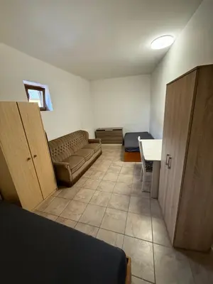 a living room with a couch and a table at Ubytování Mladá Boleslav in Mladá Boleslav