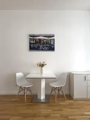 a dining room with a table and two chairs at REAL Living by REFA - New Town 210 in Prague