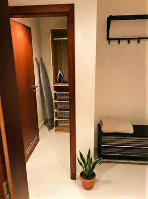 a hallway with a door and a potted plant at Fortuna Garden III in Prague