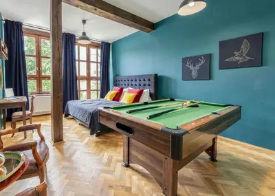 a bedroom with a bed with red and yellow pillows at Castle Charm Apartments by Wagnerstays in Prague