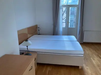 a bedroom with a large bed and a window at Apartment with two bedrooms in Prague