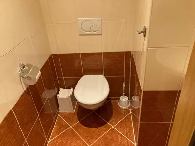 a small bathroom with a toilet in a stall at Apartment with two bedrooms in Prague