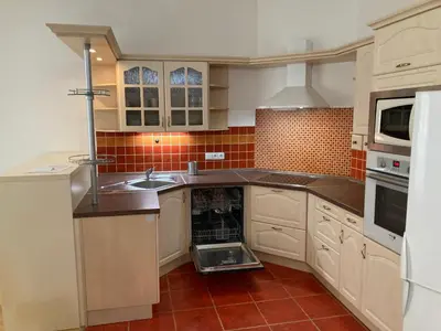 a kitchen with a dishwasher in the middle of it at Apartment with two bedrooms in Prague