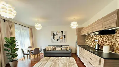a living room with a couch and a table at Fortuna Garden IV in Prague