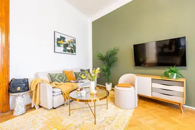 a living room with a couch and a table at Prague Days - Apartments with Parking in New Town in Prague