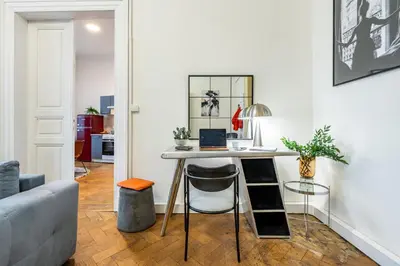a living room with a table with a laptop on it at Prague Days - Apartments with Parking in New Town in Prague
