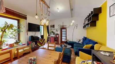 a living room with a couch and a table at La Casa Colorata apartment in the hearth of Prague in Prague