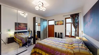a bedroom with a bed and a glass wall at La Casa Colorata apartment in the hearth of Prague in Prague