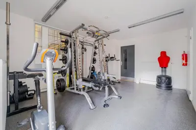 a gym with several tread machines and a red fire extinguisher at Blueground Vršovice view nr Vyšehrad PRG-84 in Prague