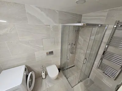 a bathroom with a shower and a toilet at Centre NEW stylish apartment & parking near O2 Arena in Prague