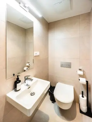 a bathroom with a white toilet and a sink at read host profile # 5BR SOHO Suites Old Town PS5 Billiards B205 in Prague