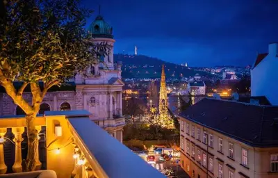 a view of a city at night with a building at read host profile # 5BR SOHO Suites Old Town PS5 Billiards B205 in Prague