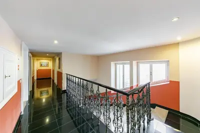 a hallway with a staircase in a house at Maisonette General Stefanik in Prague