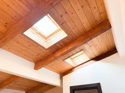 a skylight in a house with wooden ceilings at Maisonette General Stefanik in Prague