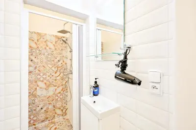 a bathroom with a shower and a sink at Casa Center Apartments in Prague