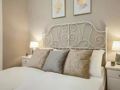 a bedroom with a white bed with two pillows at Magical Prague Old Town in Prague