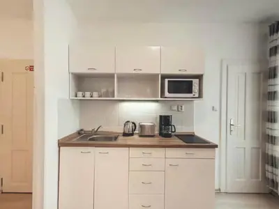 a kitchen with a sink and a microwave at Magical Prague Old Town in Prague