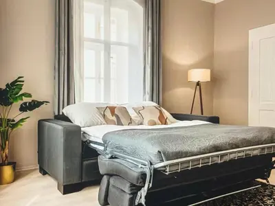 a bed in a room with a window at Magical Prague Old Town in Prague